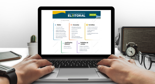 A imagem mostra um computador portátil sobre uma mesa com duas mãos posicionadas sobre o teclado...